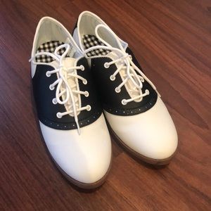 Black and white Oxford shoes